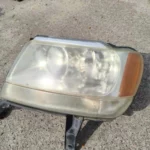 Фара передня ліва Jeep Grand Cherokee 1998-2004, 551555553AB