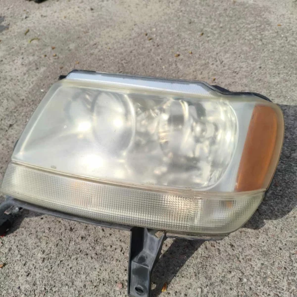 Фара передня ліва Jeep Grand Cherokee 1998-2004, 551555553AB